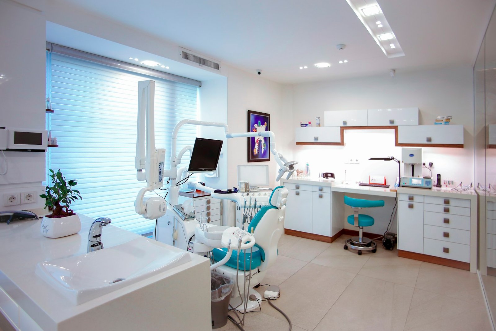 Bright, modern dental treatment room with a patient chair